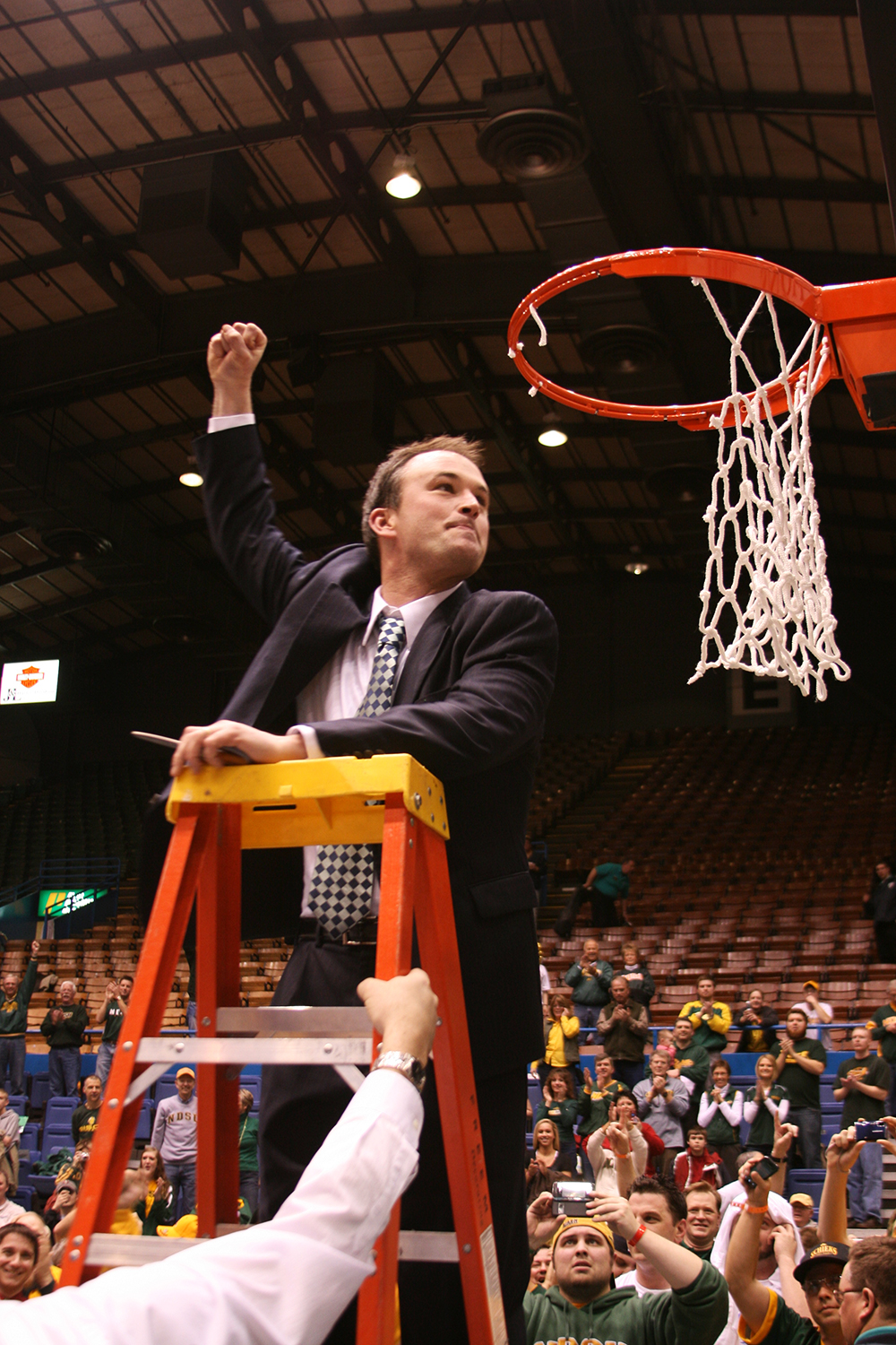 Saul Phillips pumps his fist towards the crowd as he cuts down the net at the Sioux Falls Arena in 2009.