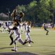 christian-watson-catches-football-during-game