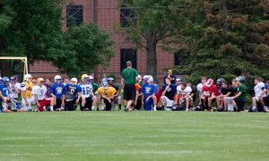 Players get ready for a practice at the Bison football summer camp